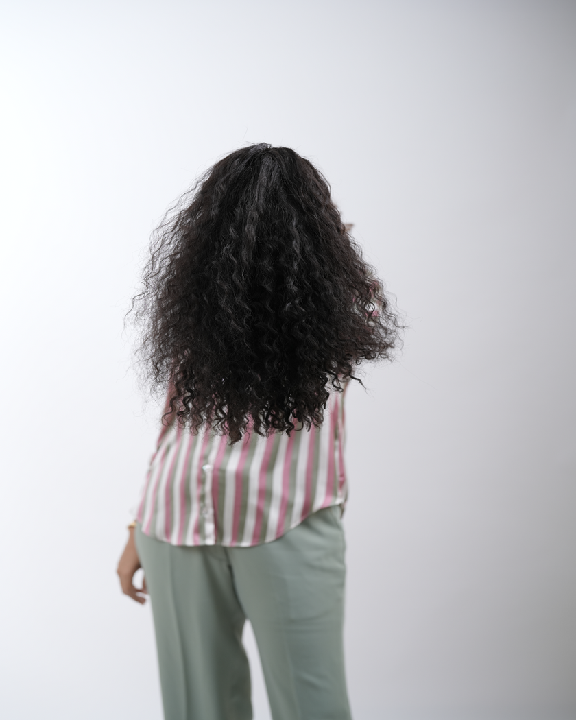 A close-up image of luxurious 100% human Remy hair extensions from Hair Haux, showcasing their soft texture, natural shine, and impeccable quality