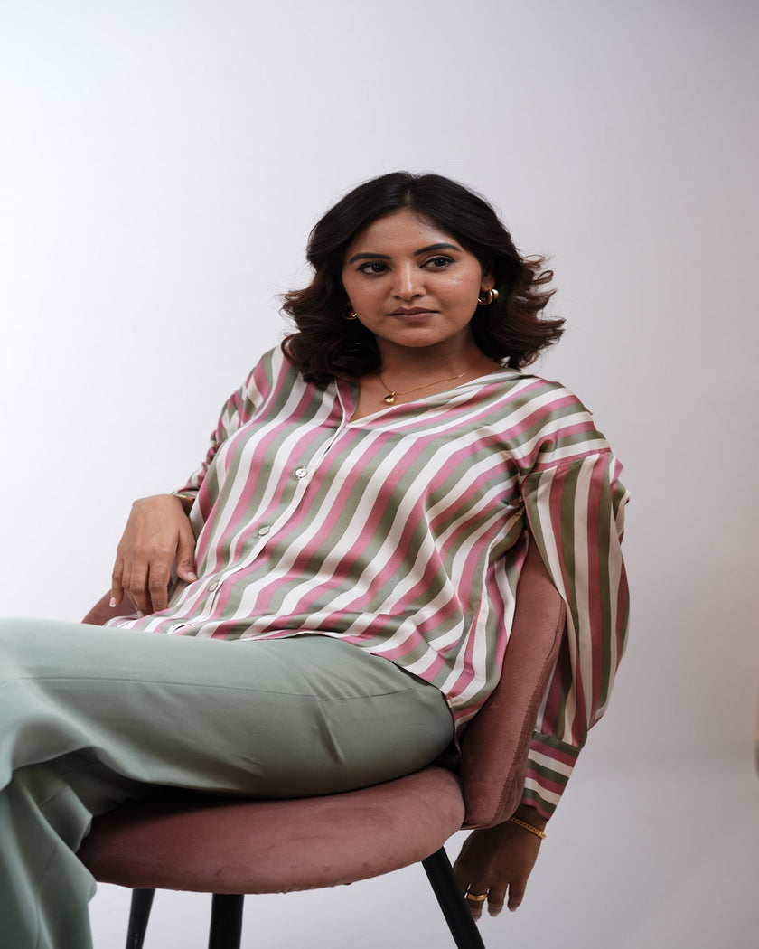 A woman showcasing a stunning traditional Indian hairstyle with voluminous waves, paired with Hair Haux Extensions for added length and a natural look