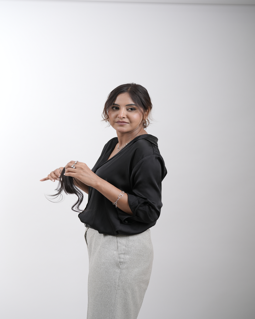 A close-up of a chic front hair fringe styled with Hair Haux extensions, showcasing smooth, sleek strands of 100% human Remy hair for a trendy and polished look