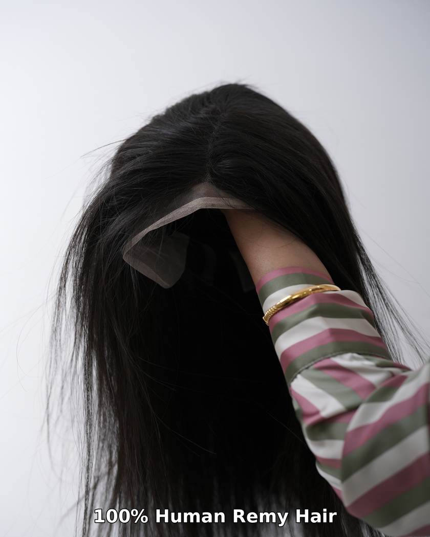 Flat lay of high-quality HairHaux hair extensions, including clip-ons, toppers, and wigs, along with a soft-bristle brush, silk scarf, and HairHaux Protein Shampoo and Conditioner on an elegant vanity table