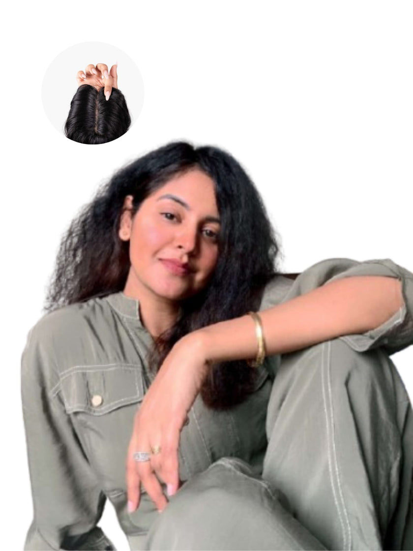 A hairstylist trimming a client's natural hair in a salon, creating a stylish and well-shaped haircut