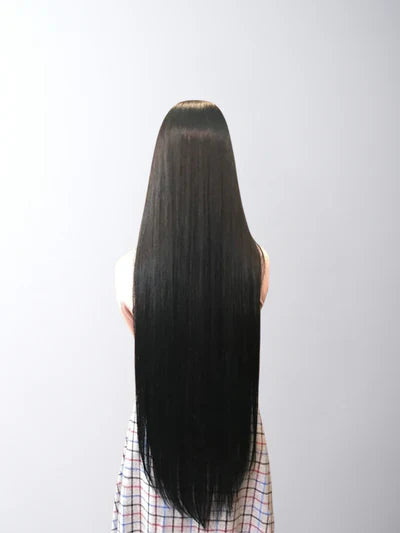 Elegant wedding hairstyle for straight hair featuring a sleek low bun enhanced with 100% human Remy hair extensions from Hair Haux for a flawless bridal look