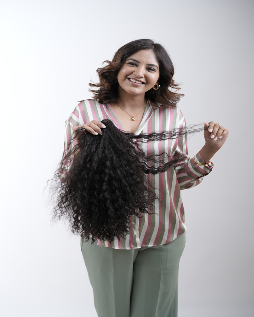 A detailed and vibrant image showcasing a variety of wigs and extensions made from 100% human remy hair, symbolizing elegance, culture, and personal expression