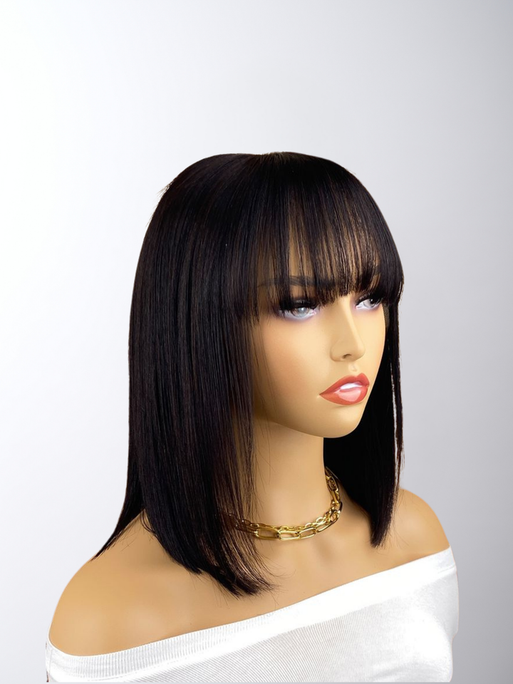 Add a chic touch to your look with our Bob Wig With Bangs, crafted from 100% Human Remy Hair. This stylish wig offers natural volume, a flawless finish, and effortless elegance for any occasion.